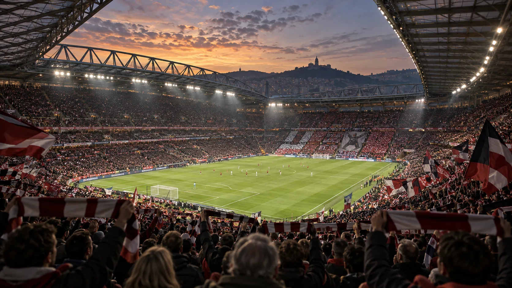 Packed football stadium at sunset with supporters holding scarves and flags as they gather around the pitch for a match.